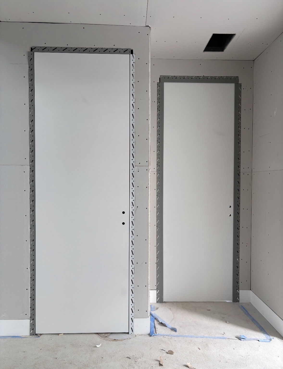 Frameless flush interior doors under construction