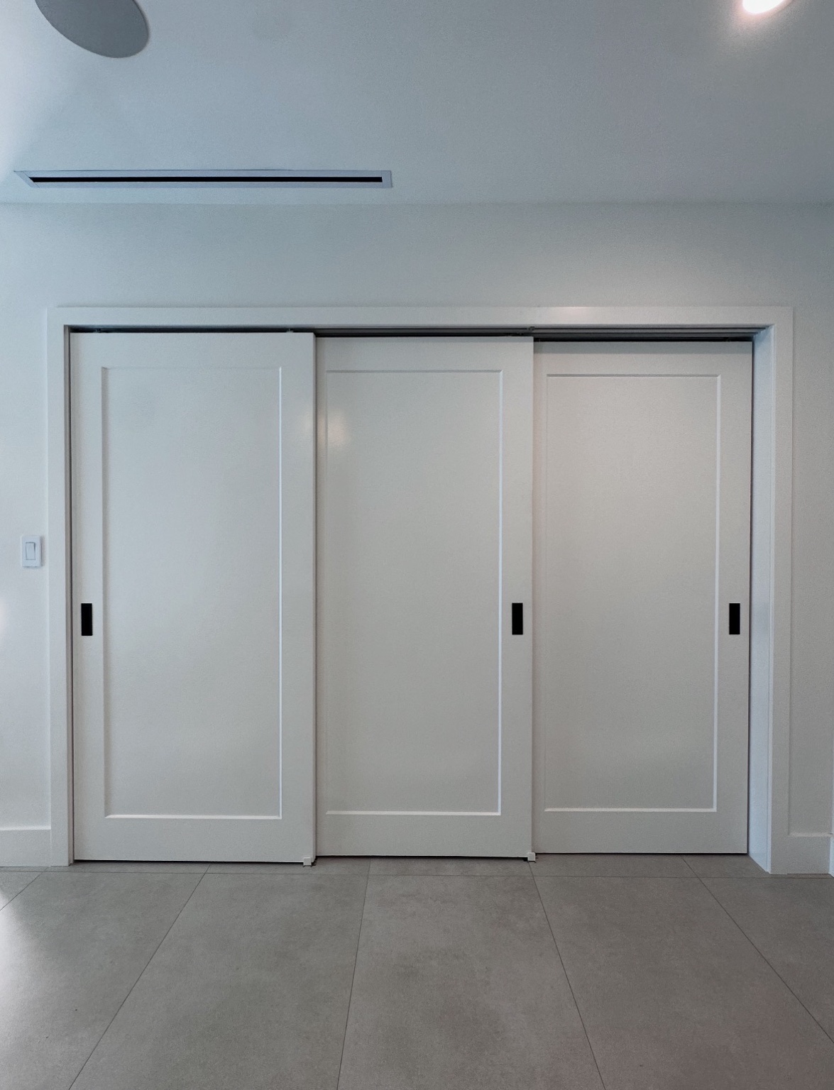 Three white bypass doors
